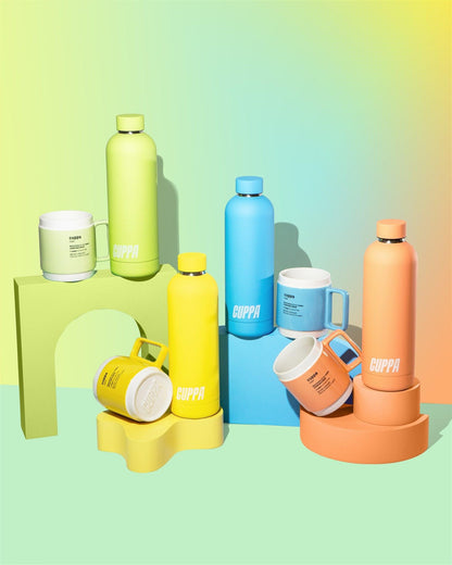 Cuppa mugs and cuppa insulated water bottles in orange yellow blue green on a mutli coloured background with rainbow effect in portrait
