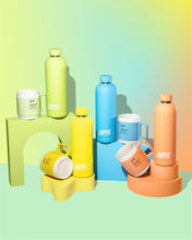 Load image into Gallery viewer, Cuppa mugs and cuppa insulated water bottles in orange yellow blue green on a mutli coloured background with rainbow effect in portrait
